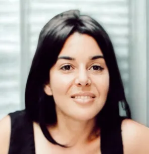 Chenoa Wanschura smiles at the camera. She wears her hair loose and a light top.